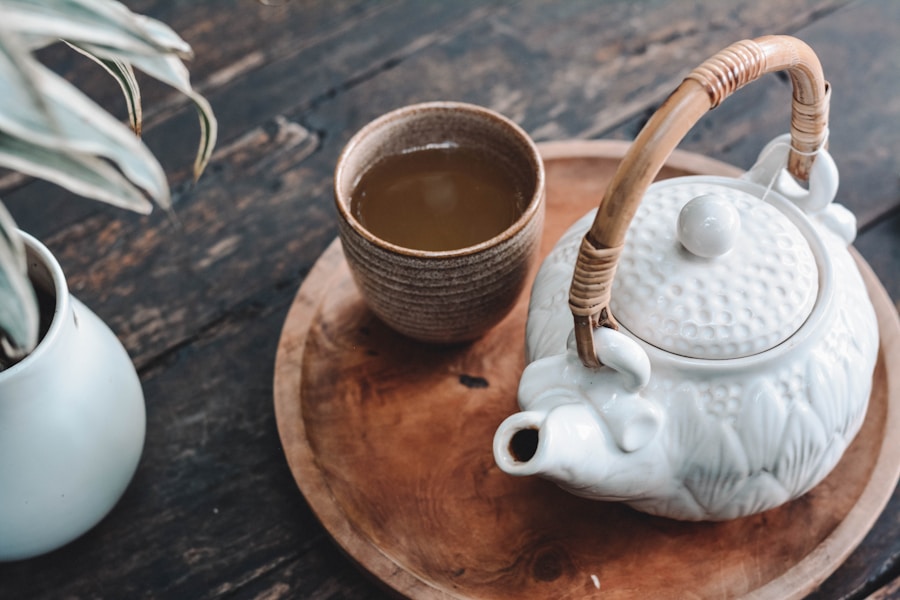 Row of tea canisters on a wooden kitchen shelf